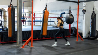 Boxer training in a gym with Rival heavy bags