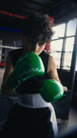 Young boxer training with Rival gloves